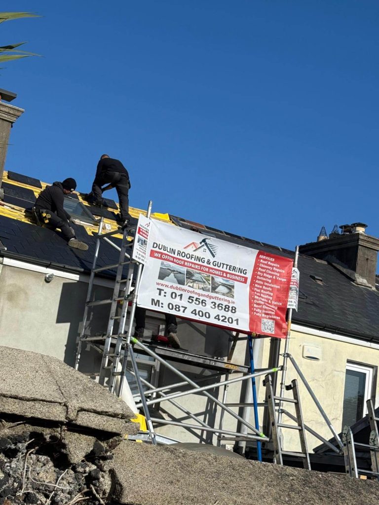 Our team working on a roof safely